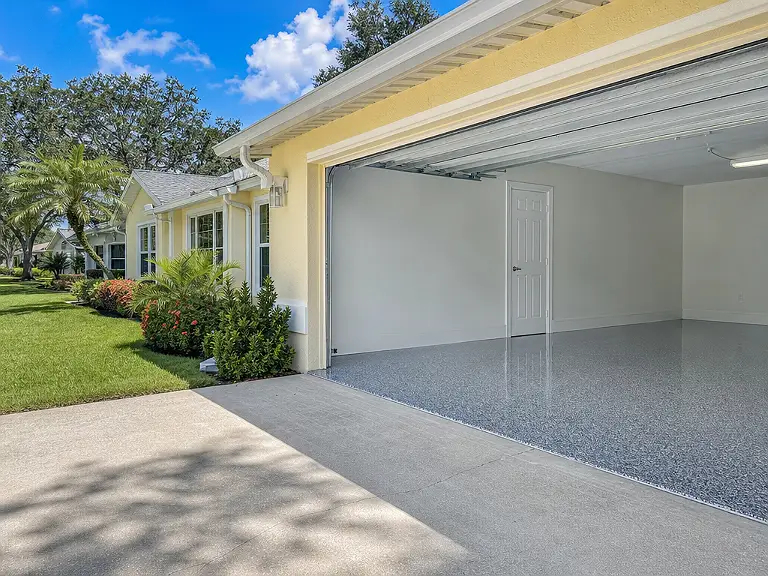 Decorative flake garage floor shown on the Bayshore Gardens service page.