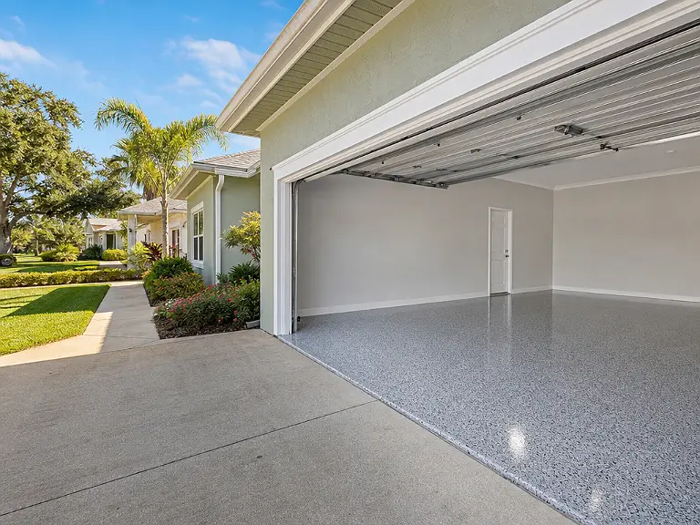 Decorative flake garage floor shown on the Gibsonton service page.