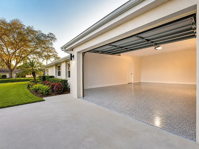 Decorative flake garage floor shown on the Jasmine Estates service page.