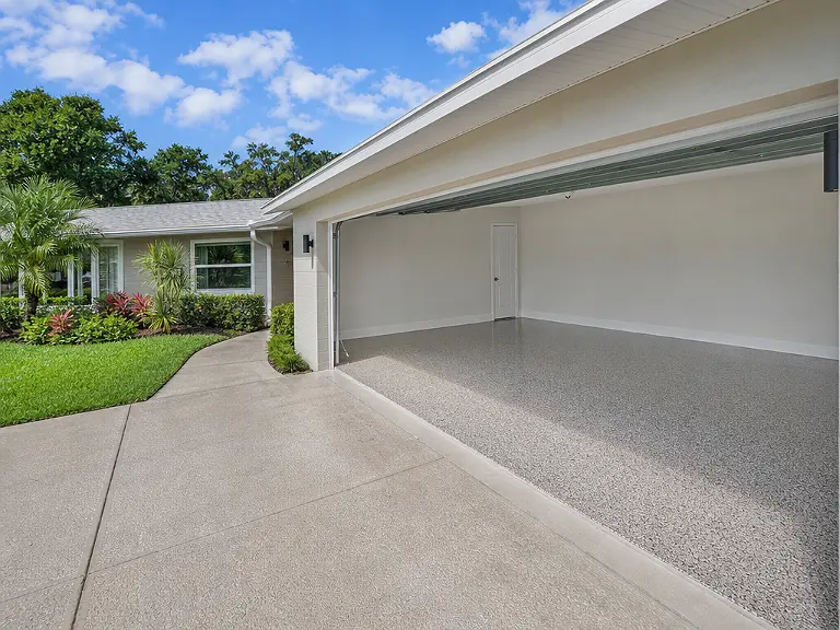Decorative flake garage floor shown on the Kenneth City service page.