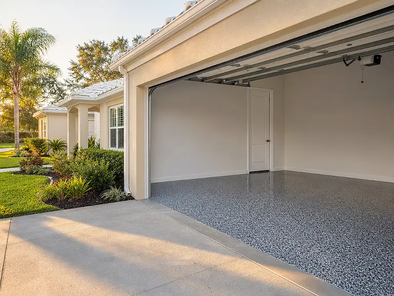 Decorative flake garage floor shown on the Progress Village service page.