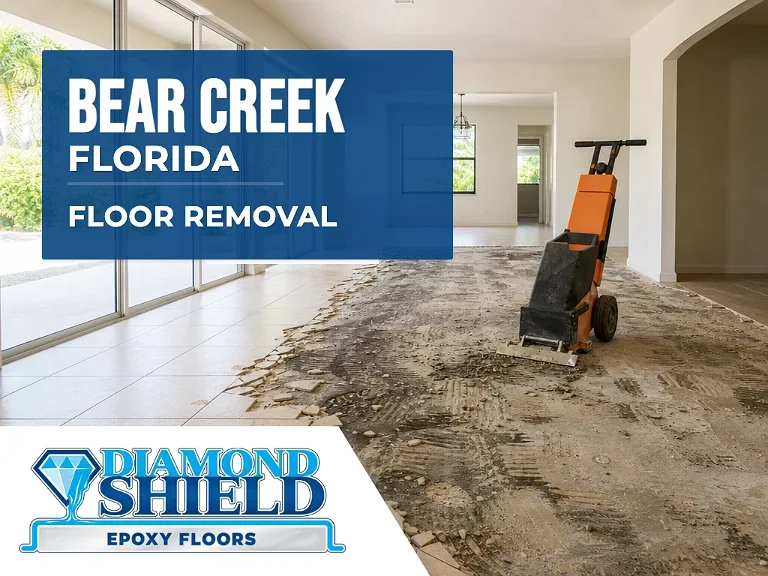 Floor removal company machine lifting tile from a slab in Bear Creek, FL