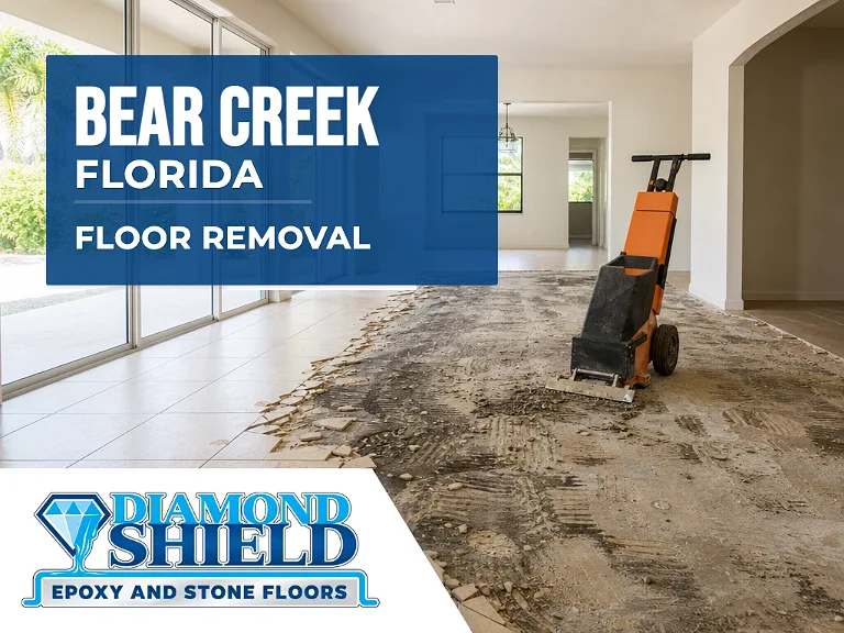 Floor removal company machine lifting tile from a slab in Bear Creek, FL
