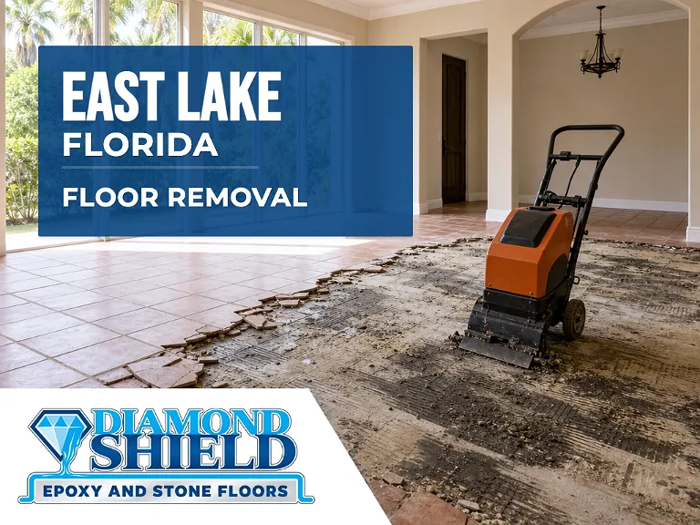 Floor removal company machine lifting tile from a slab in East Lake, FL