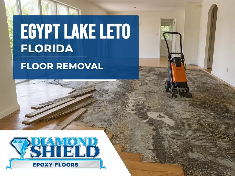 Floor removal company machine lifting tile from a slab in Egypt Lake-Leto, FL