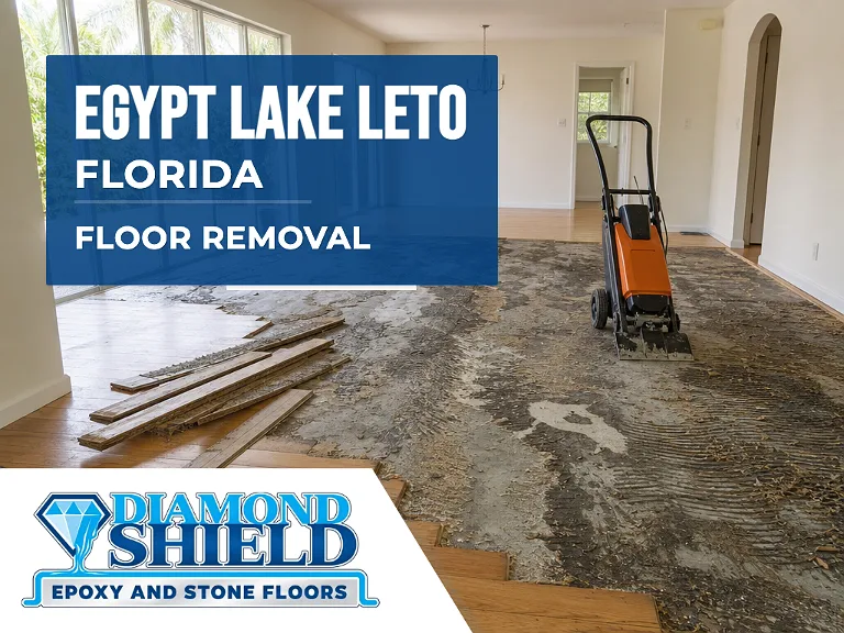 Floor removal company machine lifting tile from a slab in Egypt Lake-Leto, FL