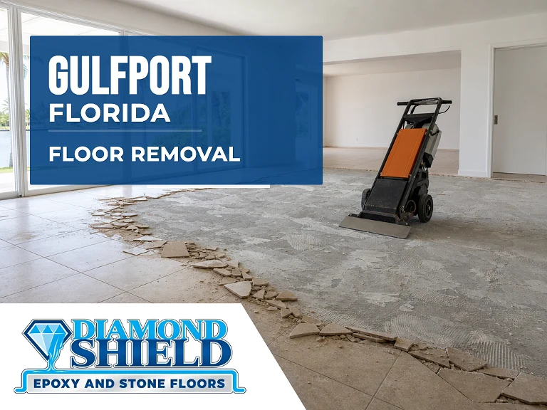 Floor removal company machine lifting tile from a slab in Gulfport, FL