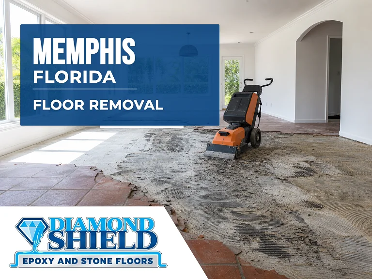 Floor removal company machine lifting tile from a slab in Memphis, FL