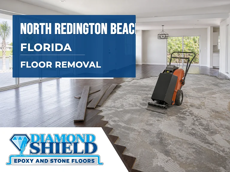 Floor removal company machine lifting tile from a slab in North Redington Beach, FL