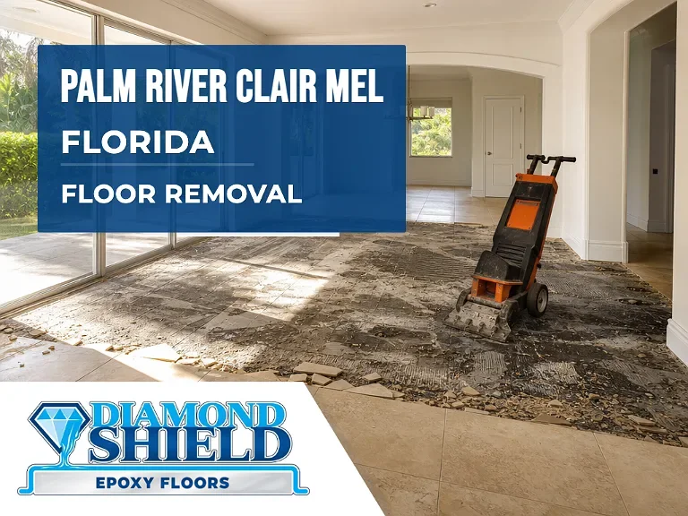 Floor removal company machine lifting tile from a slab in Palm River-Clair Mel, FL