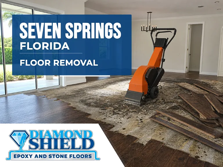 Floor removal company machine lifting tile from a slab in Seven Springs, FL