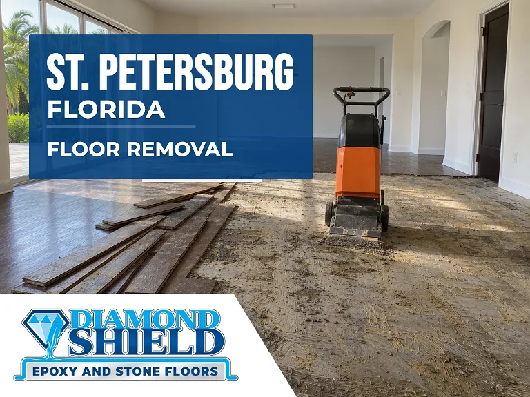 Floor removal company machine lifting tile from a slab in St. Petersburg, FL