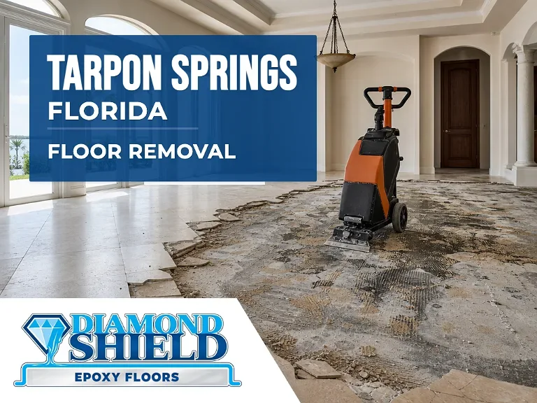 Floor removal company machine lifting tile from a slab in Tarpon Springs, FL
