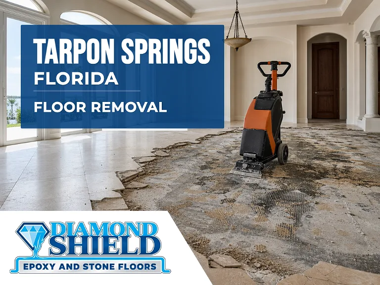 Floor removal company machine lifting tile from a slab in Tarpon Springs, FL