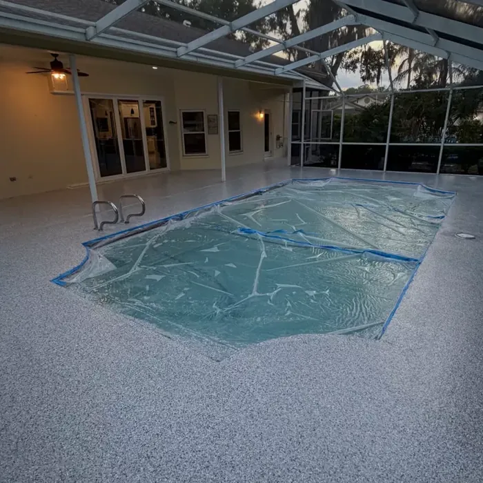 Finished pool deck coating inside a Tampa, FL screen enclosure