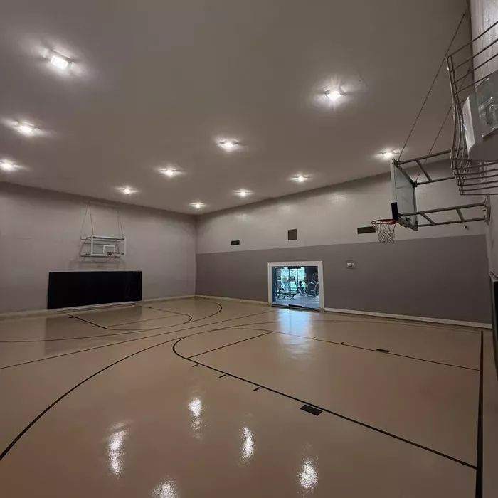 Commercial epoxy flooring on an indoor basketball court in Tampa, FL