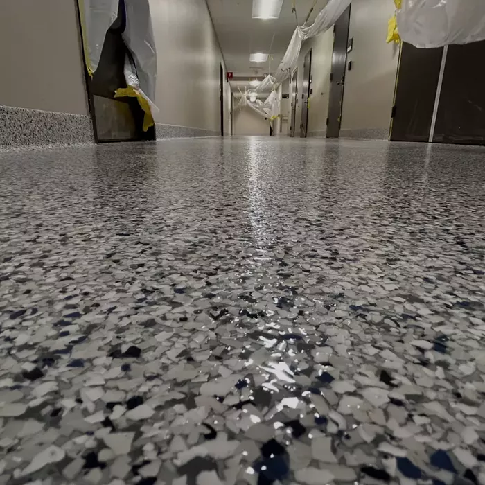 Close-up of full flake epoxy flooring with clear topcoat, Tampa, FL