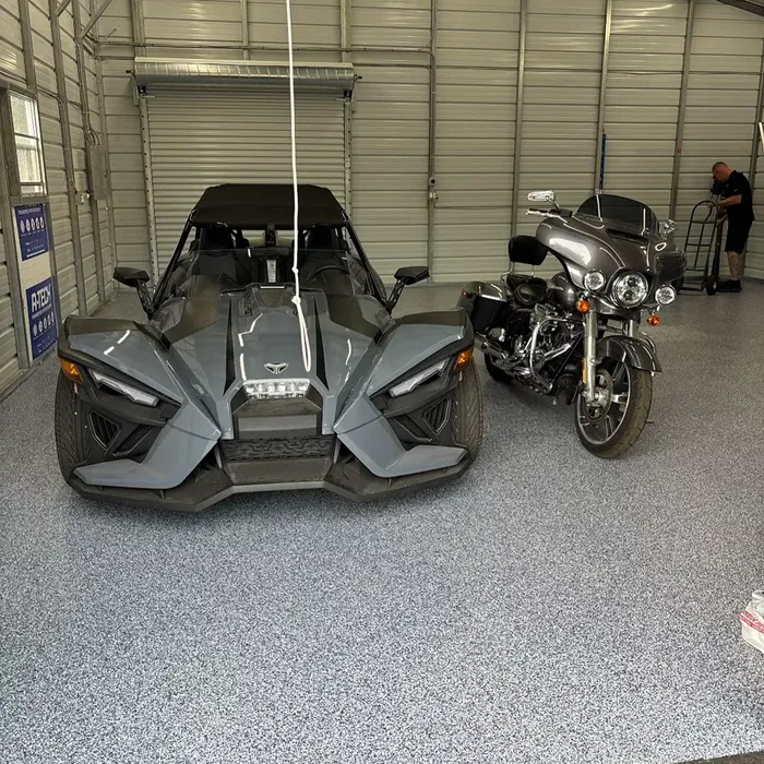 Motorcycles parked on a full-flake garage floor coating in Beacon Square, FL