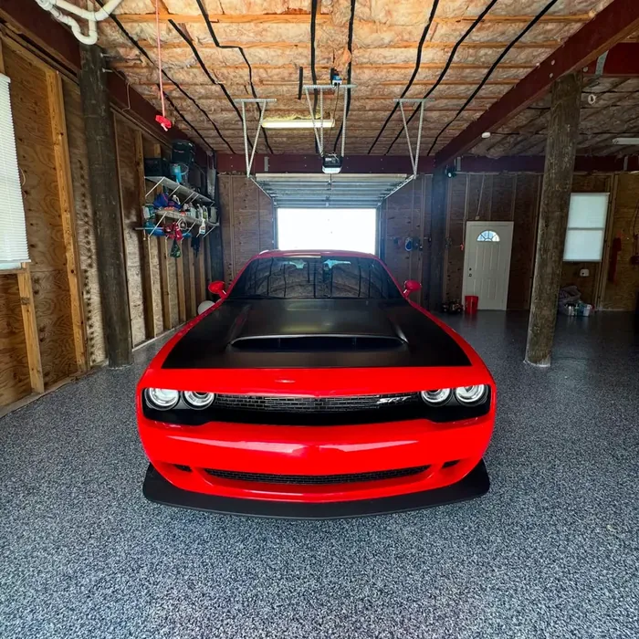 Red car parked on a finished garage floor coating in Beacon Square, FL