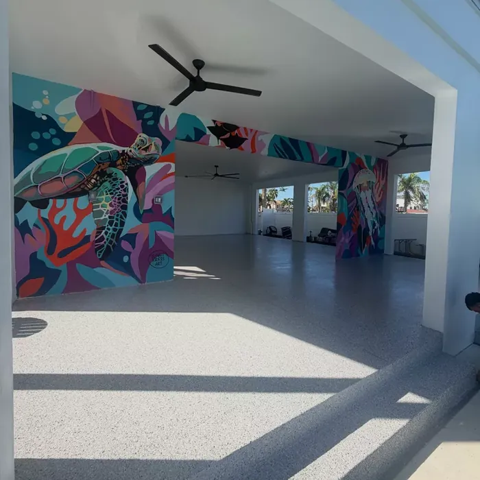 Decorative flake lanai floor beside a tropical mural