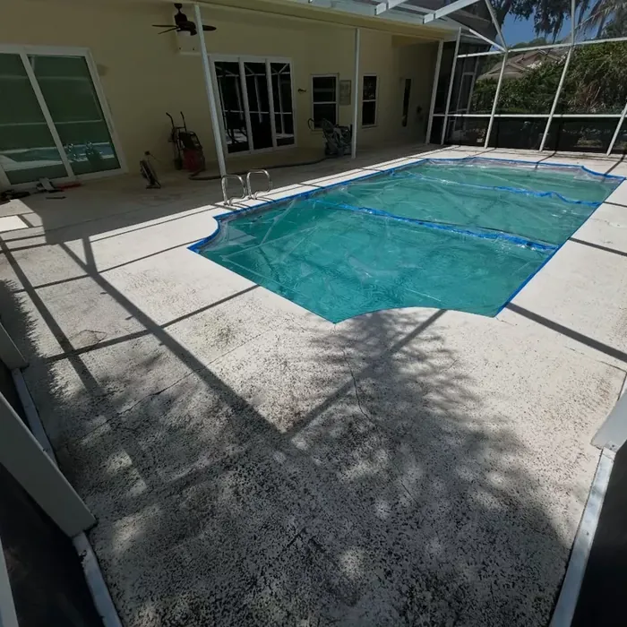 Coated pool lanai floor under a screen enclosure in Tampa, FL