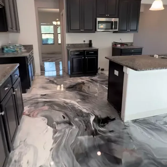Black and white metallic epoxy flooring in a Tampa, FL kitchen