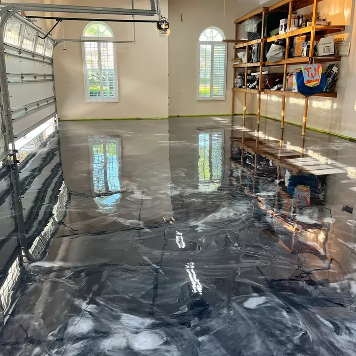 Gray metallic epoxy flooring in a Tampa, FL three-car garage
