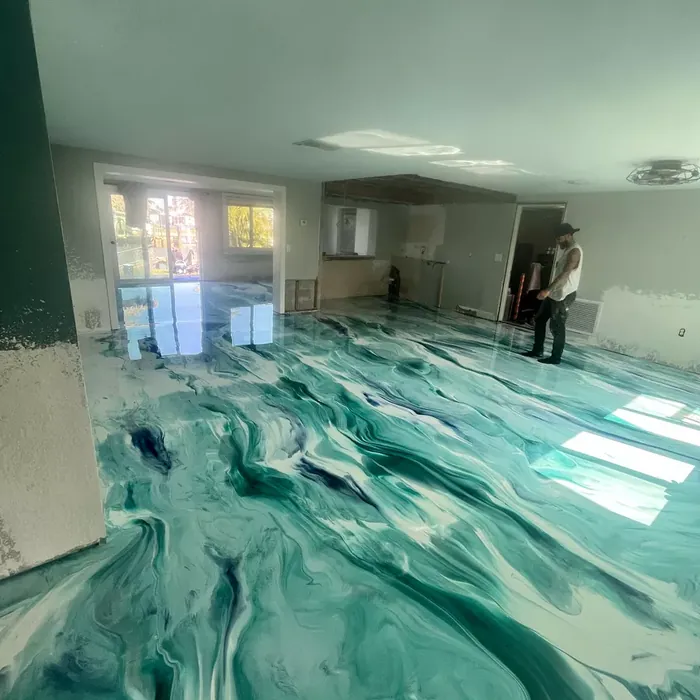 Teal metallic epoxy flooring in a Tampa, FL interior