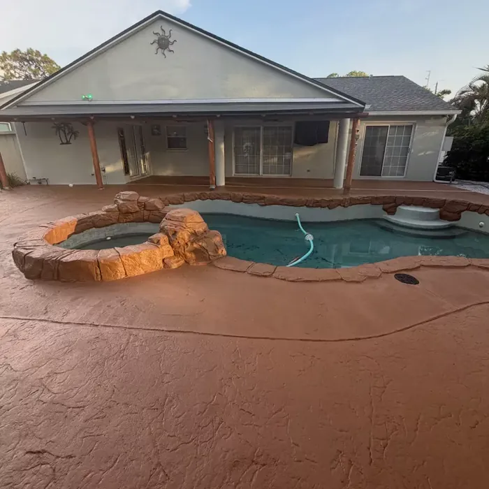 Finished coating on a residential backyard pool deck