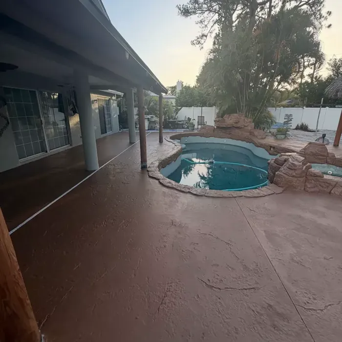 Coated pool deck connected to a covered lanai